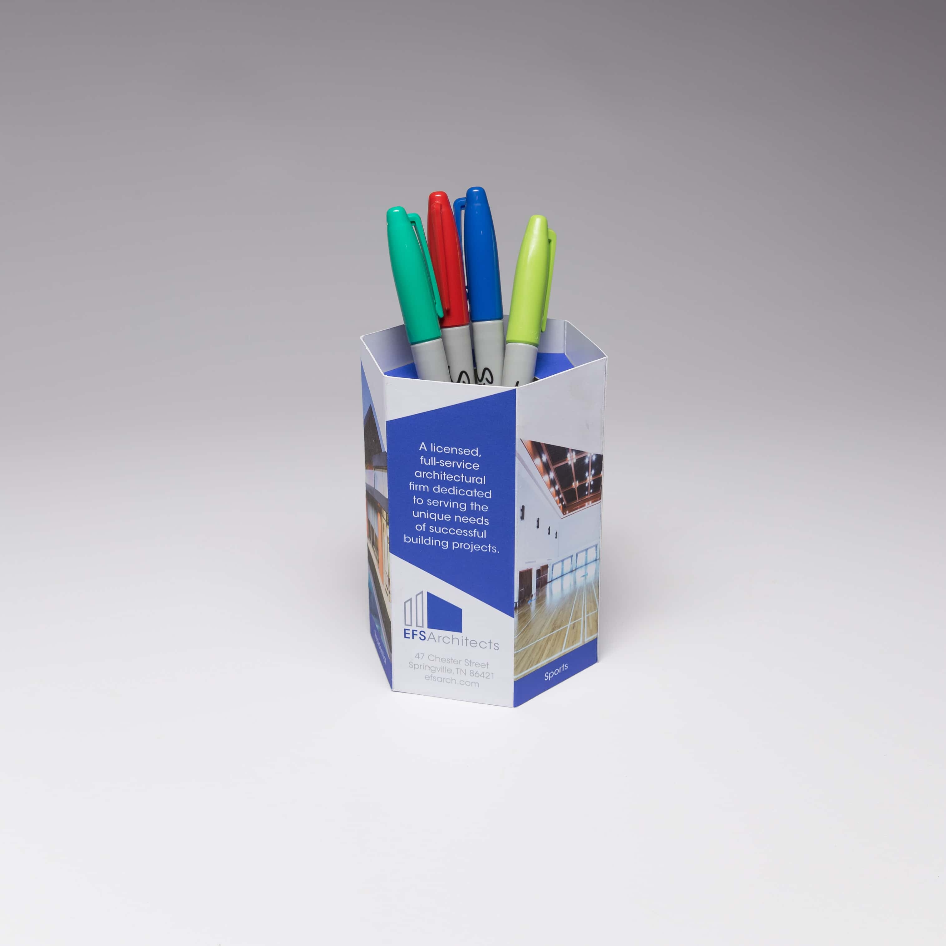 Red Paper Plane's Hexagon Pen Pot acts as a functional container that prospects will keep on their desks, as a great reminder of your brand.