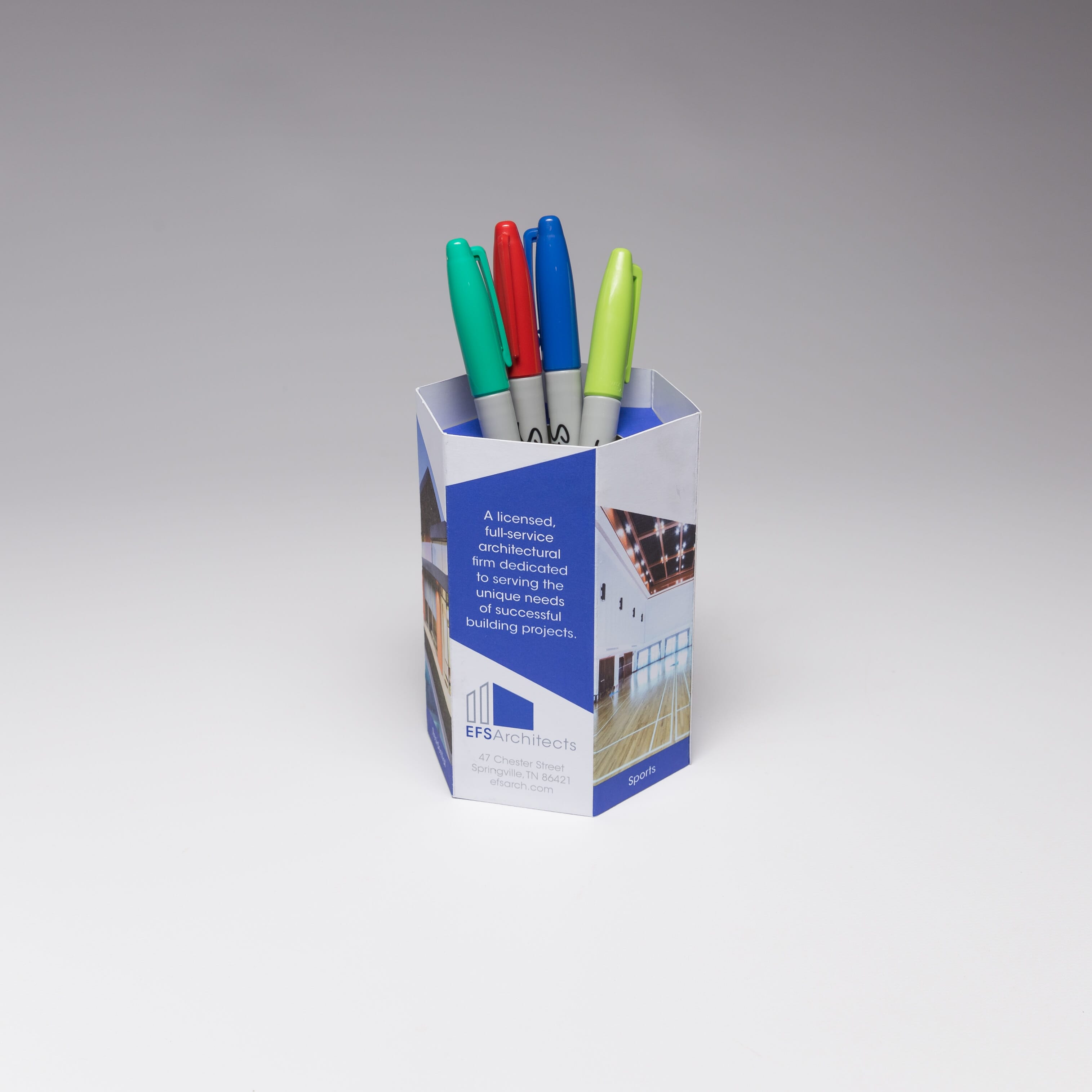 Red Paper Plane's Hexagon Pen Pot acts as a functional container that prospects will keep on their desks, as a great reminder of your brand.