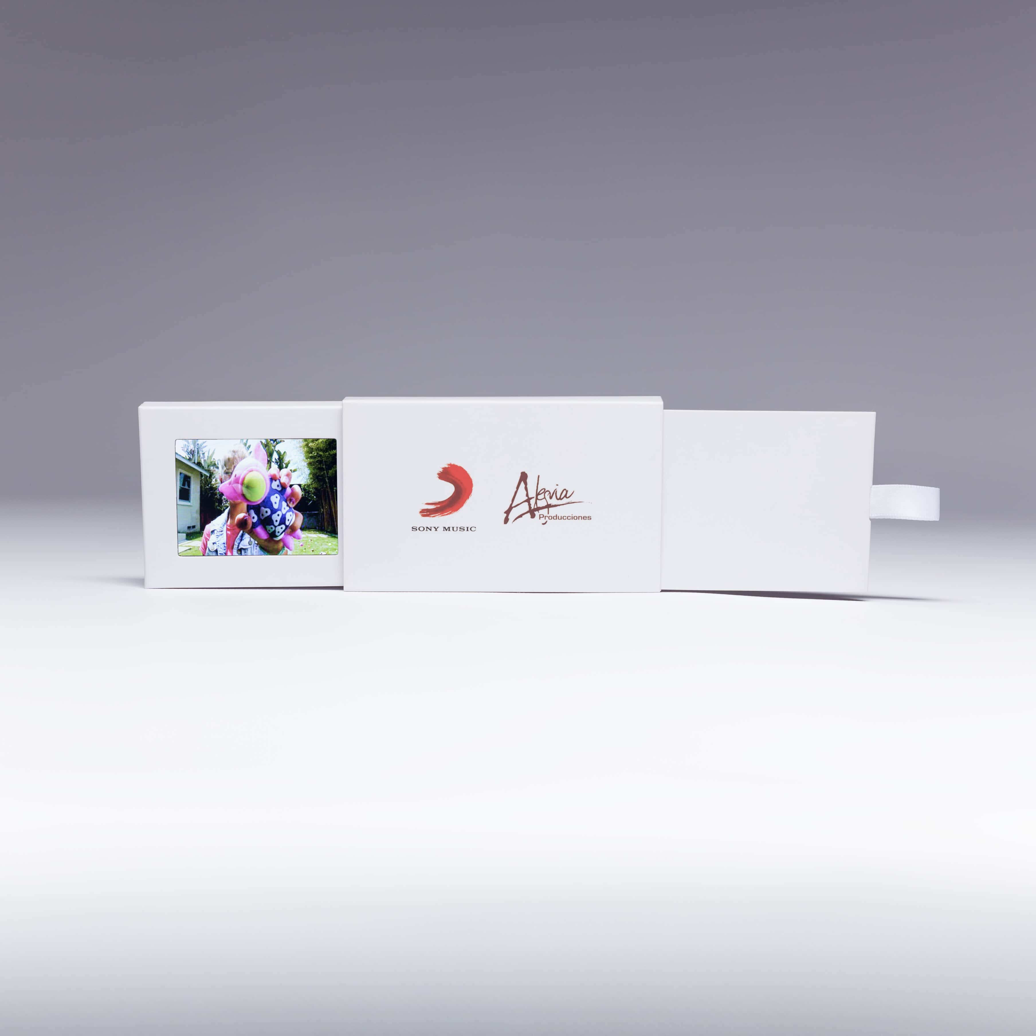 Send a marketing message that's small, but mighty with Red Paper Plane's 2.4" Video Extendo Business Card. Pulling the tab reveals an additional panel that contains a 2.4" video screen, customizable with your marketing message.